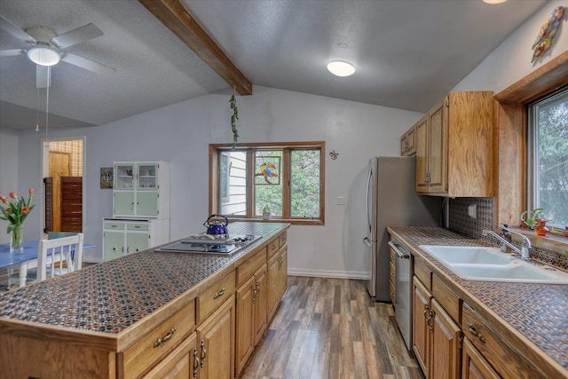 8410 E Columbia Park Dr, Spokane, WA 99212 - kitchen with a sink, wood finished floors, cooktop, ceiling fan, and dishwasher