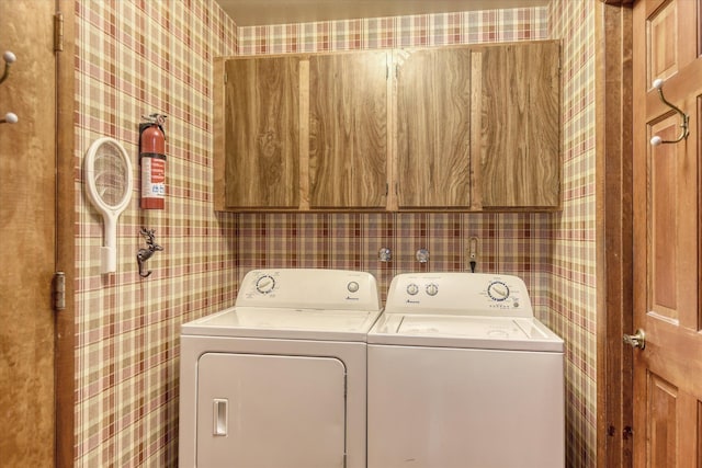 8410 E Columbia Park Dr, Spokane, WA 99212 - washroom featuring wallpapered walls, cabinet space, and washing machine and dryer