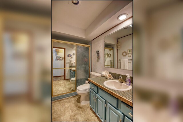 8410 E Columbia Park Dr, Spokane, WA 99212 - full bath featuring toilet, vanity, and a shower with door