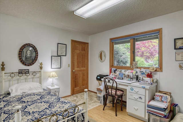 8410 E Columbia Park Dr, Spokane, WA 99212 - bedroom with a textured ceiling, an office area, and baseboards