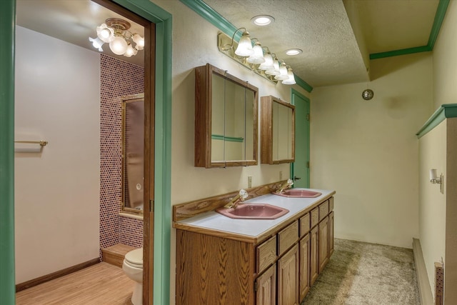 8410 E Columbia Park Dr, Spokane, WA 99212 - full bath featuring toilet, a shower, double vanity, and a textured ceiling