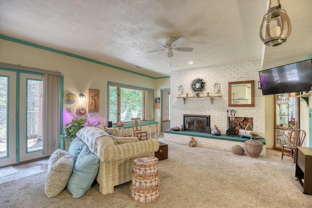 8410 E Columbia Park Dr, Spokane, WA 99212 - living area featuring carpet floors, a brick fireplace, a ceiling fan, a textured ceiling, and ornamental molding
