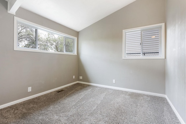 3123 E 36th Ave, Spokane, WA 99223 - spare room featuring vaulted ceiling, carpet, and baseboards