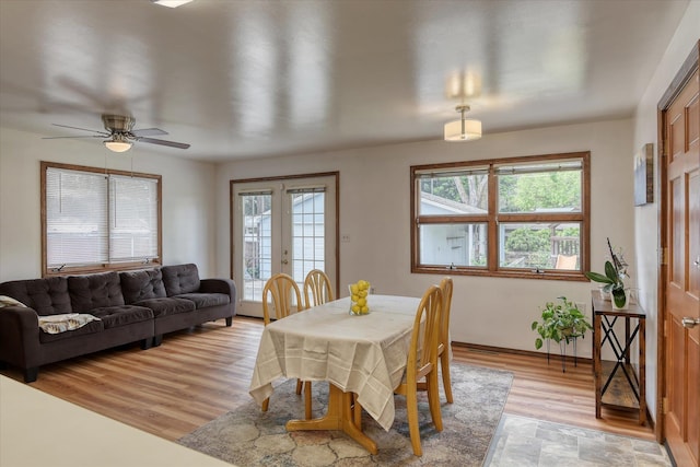 9509 N Atlantic St, Spokane, WA 99218 - dining space featuring light wood-style flooring, a ceiling fan, baseboards, and french doors