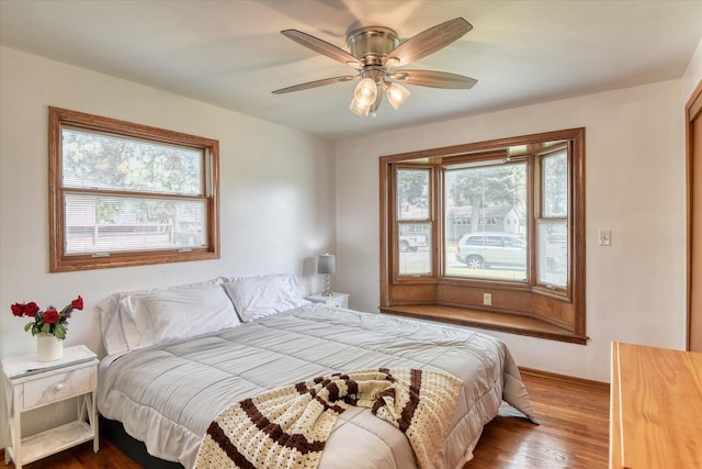 9509 N Atlantic St, Spokane, WA 99218 - bedroom featuring wood finished floors, a ceiling fan, and baseboards