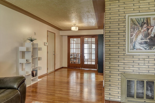 9509 N Atlantic St, Spokane, WA 99218 - living area with a textured ceiling, wood finished floors, and baseboards
