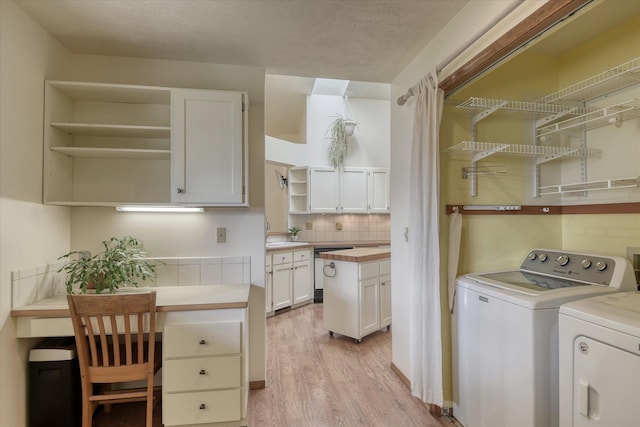 6923 N Hamilton St Unit 6923, Spokane, WA 99208 - washroom with washer and clothes dryer and light wood-style flooring