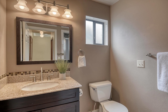 6923 N Hamilton St Unit 6923, Spokane, WA 99208 - half bathroom featuring toilet and vanity