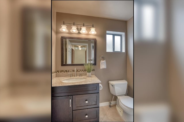 6923 N Hamilton St Unit 6923, Spokane, WA 99208 - half bath featuring toilet, tile patterned flooring, vanity, and baseboards