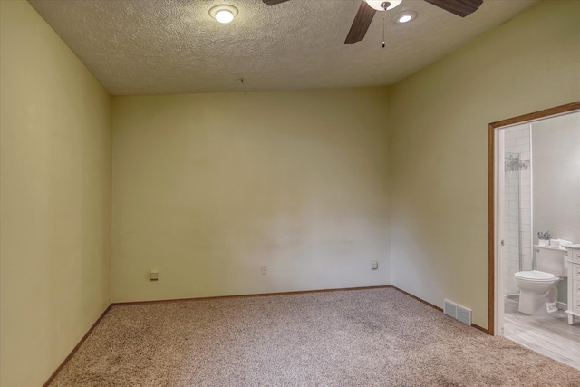 6923 N Hamilton St Unit 6923, Spokane, WA 99208 - unfurnished room featuring light carpet, ceiling fan, a textured ceiling, and baseboards