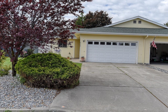 6923 N Hamilton St Unit 6923, Spokane, WA 99208 - ranch-style home featuring an attached garage, driveway, and roof with shingles