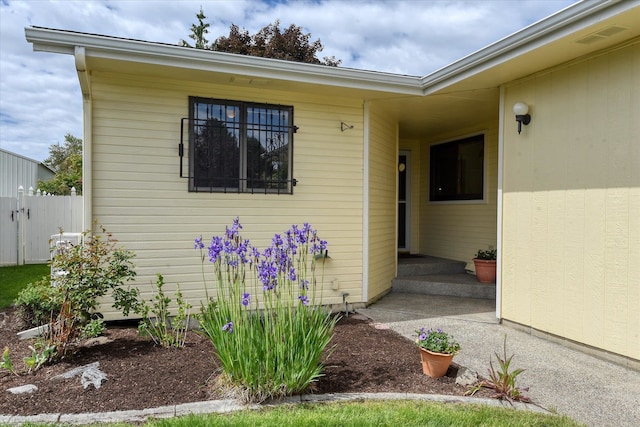 6923 N Hamilton St Unit 6923, Spokane, WA 99208 - view of exterior entry featuring fence