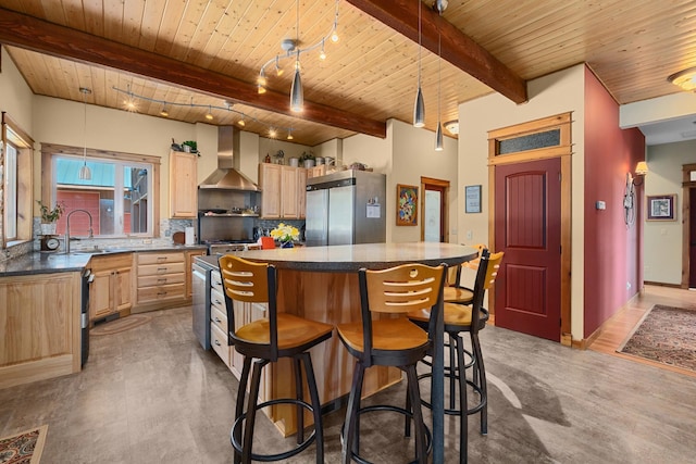 kitchen featuring wall chimney exhaust hood, wood ceiling, light brown cabinetry, a sink, and built in fridge