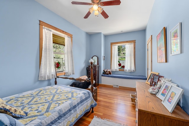 bedroom featuring wood finished floors and ceiling fan