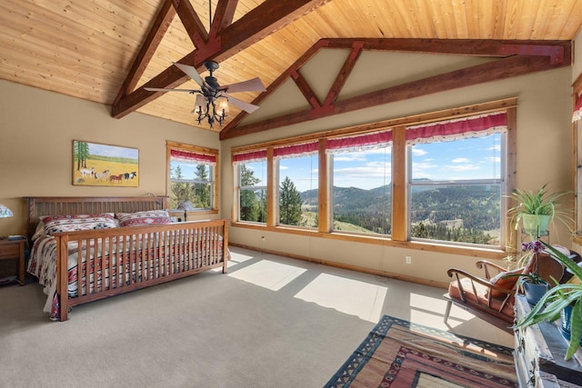 carpeted bedroom with multiple windows, beamed ceiling, wood ceiling, baseboards, and high vaulted ceiling