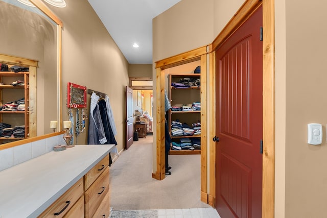 corridor with light carpet and recessed lighting