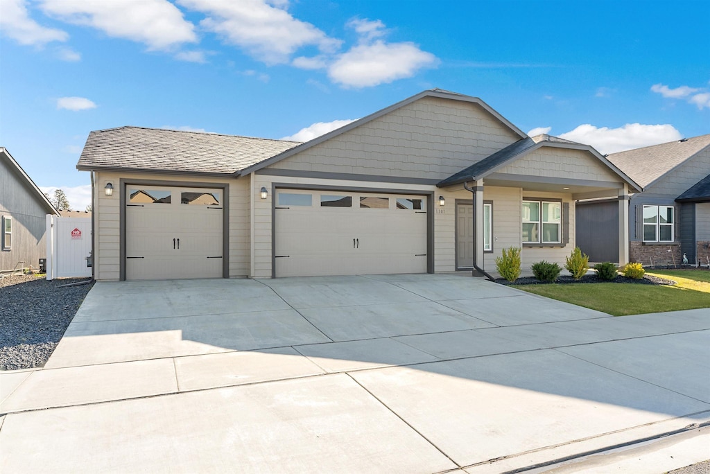 1101 S Pillar Rock Dr, Spokane, WA 99224 - single story home with an attached garage and concrete driveway