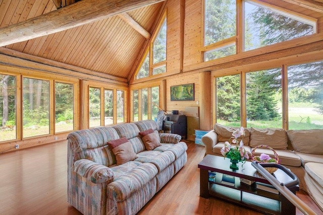 652 Penny Ln, Usk, WA 99180 - living room with high vaulted ceiling, beam ceiling, wood ceiling, and wood finished floors