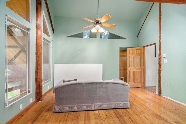 652 Penny Ln, Usk, WA 99180 - bedroom with wood-type flooring, high vaulted ceiling, and baseboards