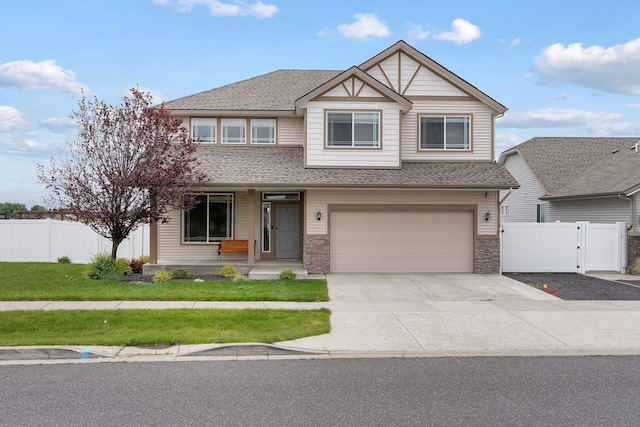 view of front of home with a porch, a gate, driveway, an attached garage, and roof with shingles