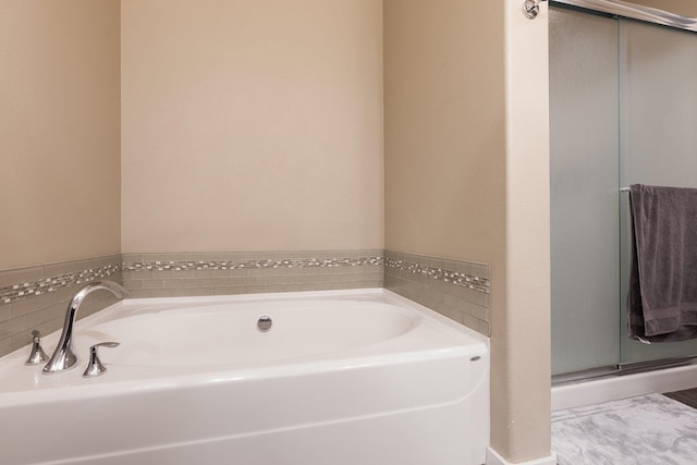 bathroom featuring a garden tub