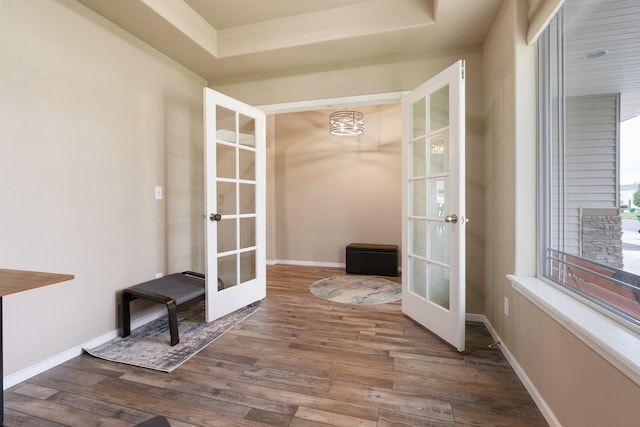 unfurnished sunroom with french doors and a chandelier
