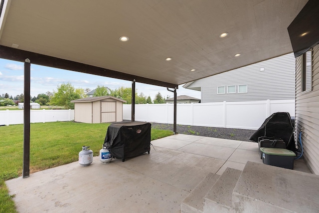 view of patio / terrace featuring a shed and an outbuilding