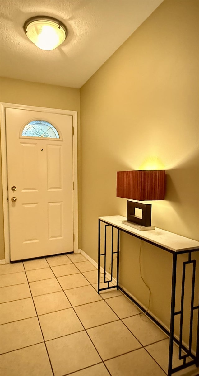 1610 S Newer Ln Unit 0, Spokane Valley, WA 99037 - foyer with light tile patterned flooring, a textured ceiling, and baseboards