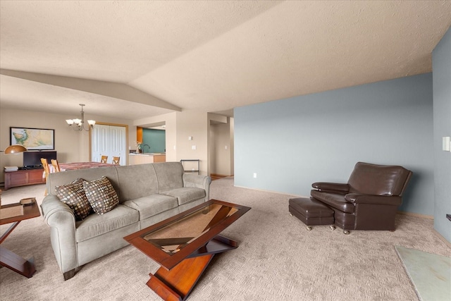 172 S Coeur Dalene St Unit G304, Spokane, WA 99204 - carpeted living area with a chandelier, vaulted ceiling, a sink, baseboards, and a textured ceiling
