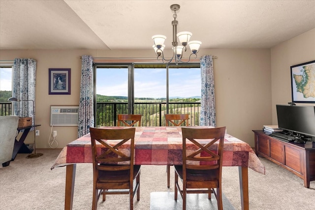172 S Coeur Dalene St Unit G304, Spokane, WA 99204 - dining space featuring a chandelier, healthy amount of natural light, and light carpet