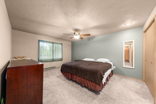 172 S Coeur Dalene St Unit G304, Spokane, WA 99204 - bedroom with baseboard heating, light carpet, a textured ceiling, and a ceiling fan