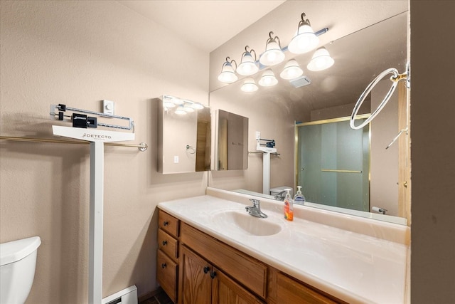 172 S Coeur Dalene St Unit G304, Spokane, WA 99204 - full bath with a stall shower, toilet, vanity, and a baseboard radiator