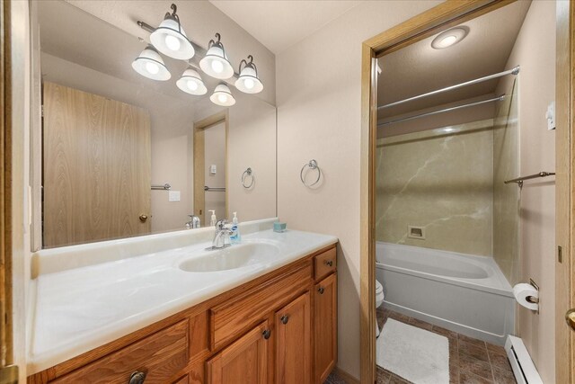 172 S Coeur Dalene St Unit G304, Spokane, WA 99204 - bathroom featuring baseboard heating, toilet, vanity, and shower / bathtub combination
