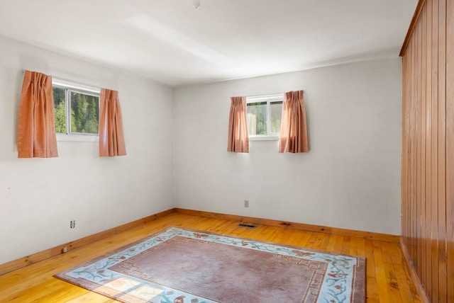 4345 Wilcox Rd, Northport, WA 99157 - unfurnished room with light wood finished floors, plenty of natural light, and baseboards