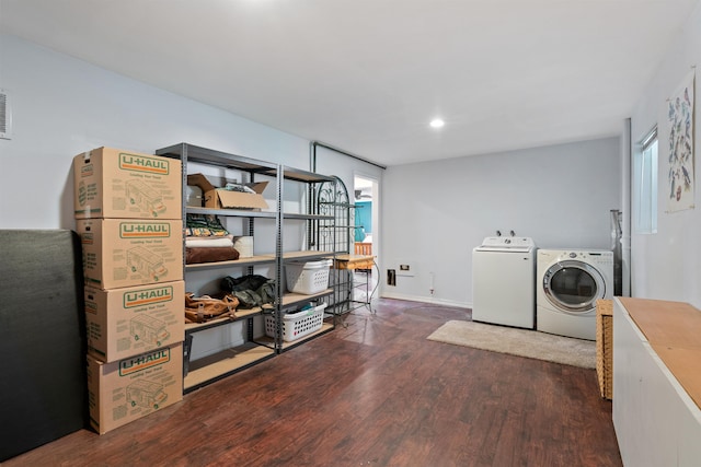 washroom with wood finished floors and washer and clothes dryer