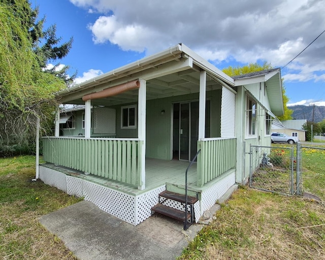 306 S Bernard St, Chewelah, WA 99109 - view of front of house with a porch and fence