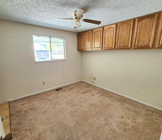 306 S Bernard St, Chewelah, WA 99109 - carpeted empty room featuring ceiling fan, baseboards, and a textured ceiling
