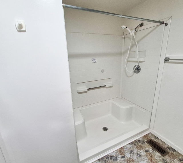 306 S Bernard St, Chewelah, WA 99109 - bathroom featuring a shower and baseboards