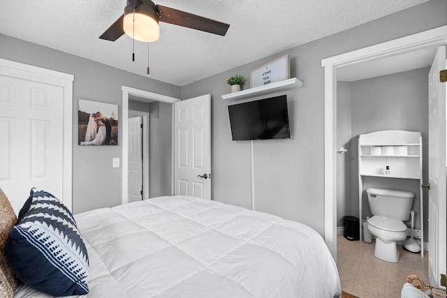 8214 N Jefferson Dr, Spokane, WA 99208 - tiled bedroom featuring a textured ceiling and ceiling fan