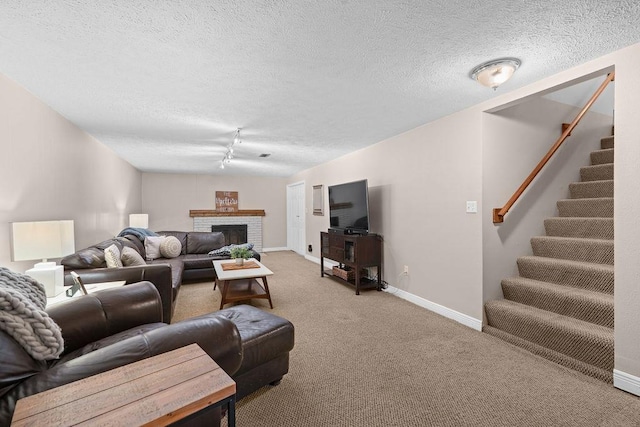 8214 N Jefferson Dr, Spokane, WA 99208 - living room featuring carpet flooring, a textured ceiling, stairs, baseboards, and a brick fireplace