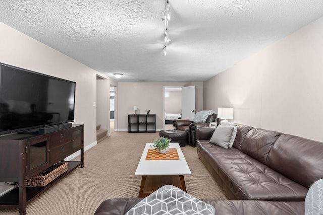 8214 N Jefferson Dr, Spokane, WA 99208 - carpeted living room featuring a textured ceiling, rail lighting, stairway, and baseboards
