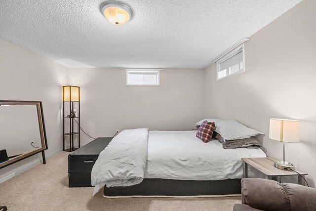 8214 N Jefferson Dr, Spokane, WA 99208 - carpeted bedroom with a textured ceiling and multiple windows