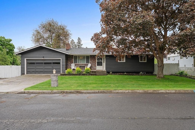 8214 N Jefferson Dr, Spokane, WA 99208 - single story home featuring an attached garage, driveway, and a chimney