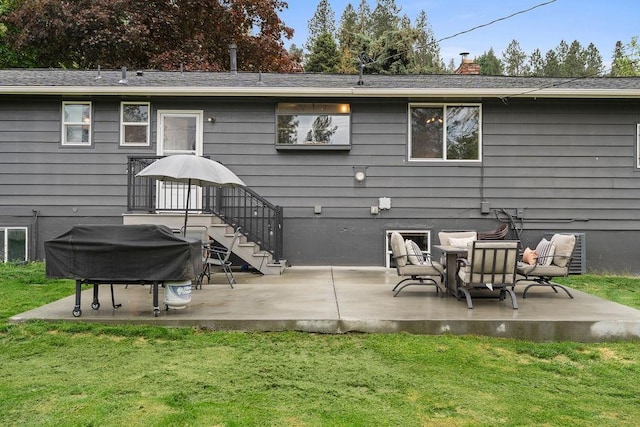 8214 N Jefferson Dr, Spokane, WA 99208 - back of property featuring a yard, a patio, and a chimney