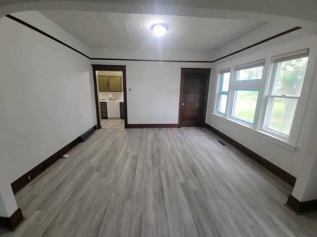 33 E Everett Ave, Spokane, WA 99207 - unfurnished bedroom featuring light wood-style floors and ensuite bath