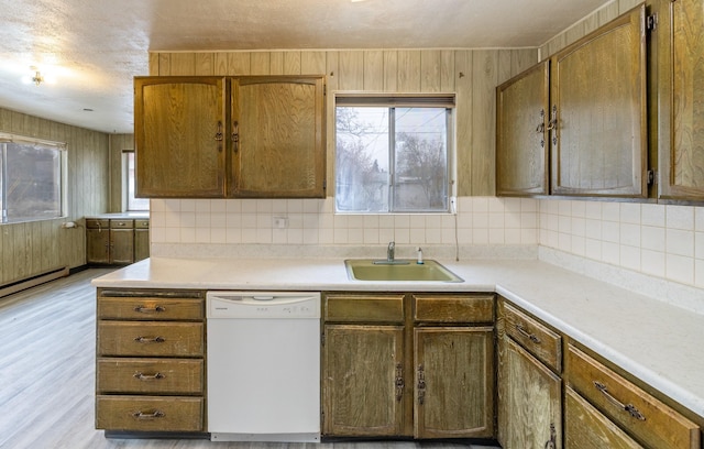 33 E Everett Ave, Spokane, WA 99207 - kitchen featuring dishwasher, light countertops, and tasteful backsplash