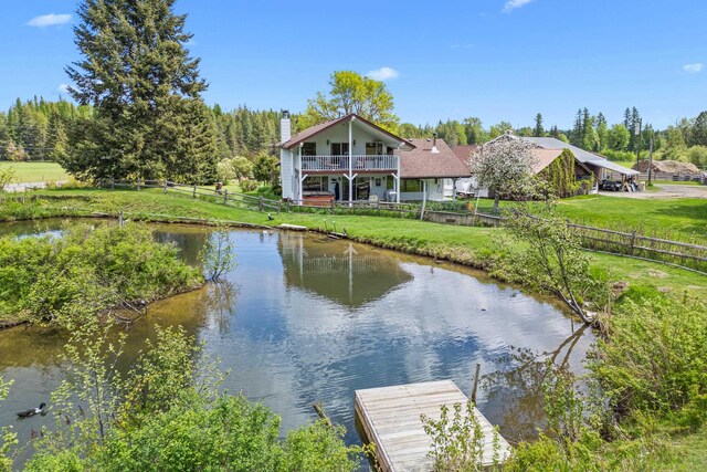 2443 Flowery Trail Rd, Usk, WA 99180 - water view featuring a dock and a fenced backyard