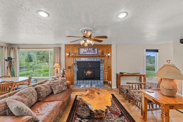 2443 Flowery Trail Rd, Usk, WA 99180 - living room with a textured ceiling, plenty of natural light, ceiling fan, and wood finished floors