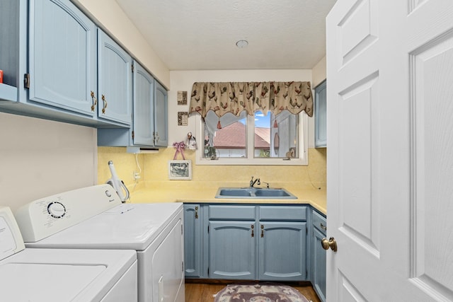 2443 Flowery Trail Rd, Usk, WA 99180 - clothes washing area featuring separate washer and dryer, cabinet space, and dark wood finished floors