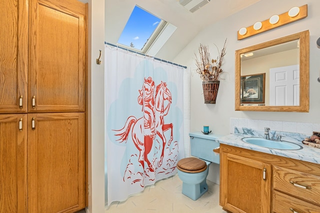 2443 Flowery Trail Rd, Usk, WA 99180 - full bath with vanity, toilet, a shower with curtain, a skylight, and lofted ceiling